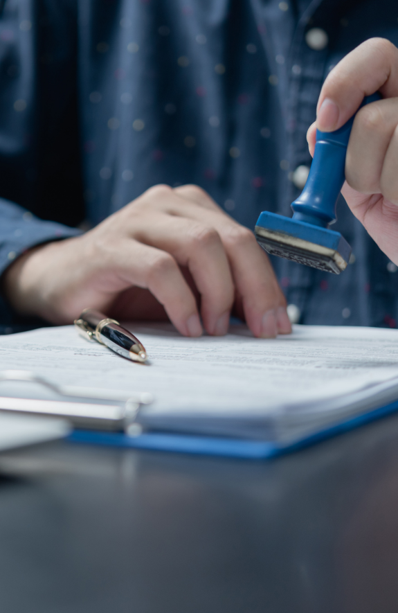 Two professionals reviewing building permit documents