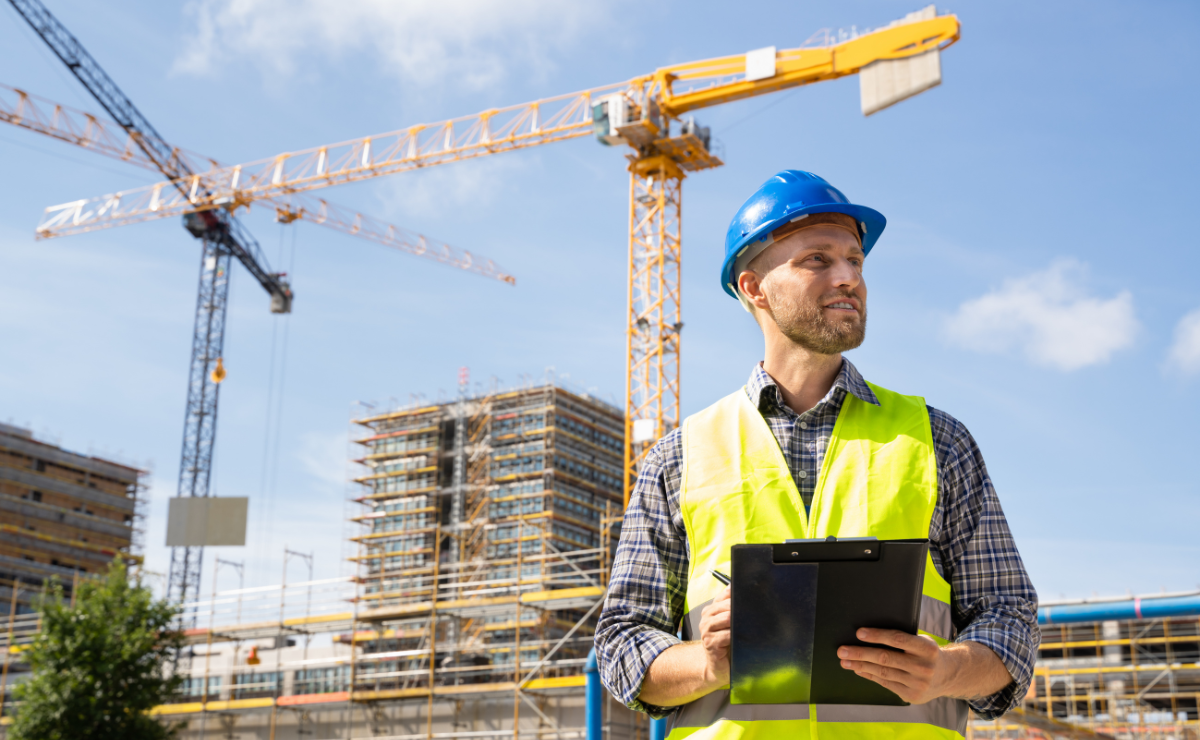 Two professionals reviewing building plans together